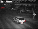 A marked photo radar vehicle is pictured just before it runs a red light at Yellowhead Trail and 127 Street in Edmonton in June 2021. 