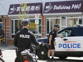 Police patrol the downtown Edmonton Chinatown district on Thursday May 26, 2022.