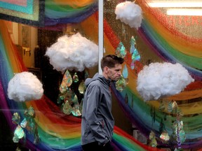 Edmonton Weather: Wet, Over 40 Mm Of Rain In The Last 24 Hours 2 A Pedestrian Makes His Way Through The Rain Near A Window Display At Maven & Grace Hardwares, 9609 82Nd Avenue On Tuesday, June 14, 2022 In Edmonton.