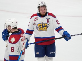 Edmonton Oil Kings' Jake Neighbours, right, and teammate Luke Prokop react after their loss to the Hamilton Bulldogs during Memorial Cup hockey action in Saint John, N.B. on Friday, June 24, 2022.