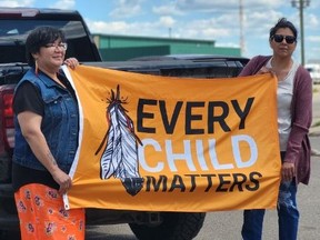 Patronella Lewis and her support, Carmen Carter (in denim vest), on Tuesday, May 31, 2022, after the meeting between Alberta Child Services officials and Onion Lake Cree Nation leadership. The meeting followed an incident May 12, in which child services workers attempted to take her granddaughter into foster care.