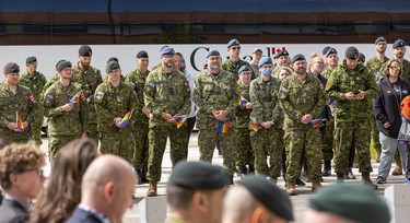 Military members take part in a Pride flag raising ceremony and Pride walk at Canadian Division Support Base (3 CDSB) to celebrate Pride Month on Friday, June 24, 2022 .  This is the first time there has been a Pride parade held at a military base in Canada.