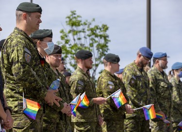 Military members take part in a Pride flag raising ceremony and Pride walk at Canadian Division Support Base (3 CDSB) to celebrate Pride Month on Friday, June 24, 2022 .  This is the first time there has been a Pride parade held at a military base in Canada.