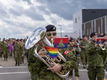 Military members take part in a Pride Parade after a Pride flag raising ceremony at Canadian Division Support Base (3 CDSB) to celebrate Pride Month on Friday, June 24, 2022 .  This is the first time there has been a Pride parade held at a military base in Canada.