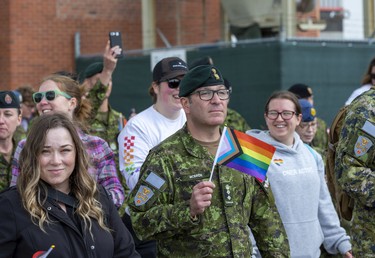Military members take part in a Pride Parade after a Pride flag raising ceremony at Canadian Division Support Base (3 CDSB) to celebrate Pride Month on Friday, June 24, 2022 .  This is the first time there has been a Pride parade held at a military base in Canada.