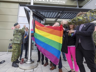 Major John McDougall raises the Pride flag and then participates in a Pride walk at 3rd Canadian Division Support Base (3 CDSB) to celebrate Pride Season at 3rd  on Friday, June 24, 2022 .  This is the first time there has been a Pride parade held at a military base in Canada.