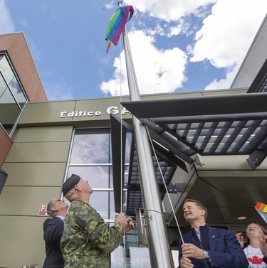 Major John McDougall raises the Pride flag and then participates in a Pride walk at 3rd Canadian Division Support Base (3 CDSB) to celebrate Pride Season at 3rd  on Friday, June 24, 2022 .  This is the first time there has been a Pride parade held at a military base in Canada.