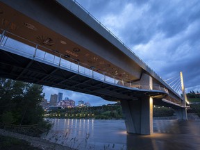 The city skyline can be seen under the Tawatinâ Bridge on Thursday, June 16, 2022, in Edmonton. A high streamflow advisory is in place for the North Saskatchewan River and water levels are expected to peak on Friday morning.