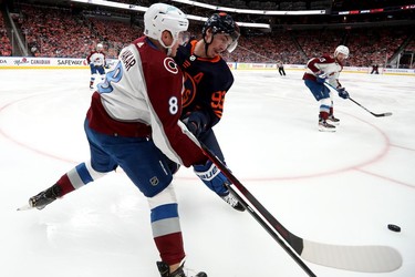 Edmonton Oilers' Ryan Nugent-Hopkins (93) battles the Colorado Avalanche's Cale Makar (8) during Game 3 of the Western Conference Final at Rogers Place, in Edmonton Saturday June 4, 2022.