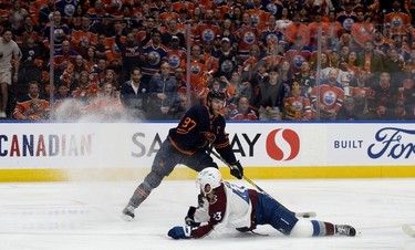 Edmonton Oilers' Connor McDavid (97) battles the Colorado Avalanche's Darren Helm (43) during Game 3 of the Western Conference Final at Rogers Place, in Edmonton Saturday June 4, 2022.