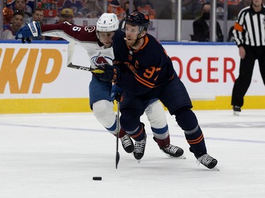 Edmonton Oilers' Connor McDavid (97) battles the Colorado Avalanche's Erik Johnson (6) during Game 3 of the Western Conference Final at Rogers Place, in Edmonton Saturday June 4, 2022.