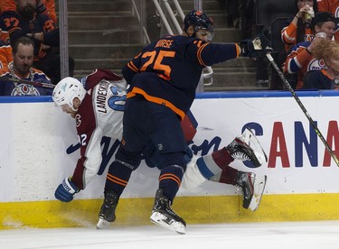 Edmonton Oilers' Darnell Nurse (25) checks the Colorado Avalanche's Gabriel Landeskog (92) during Game 3 of the Western Conference Final at Rogers Place, in Edmonton Saturday June 4, 2022.