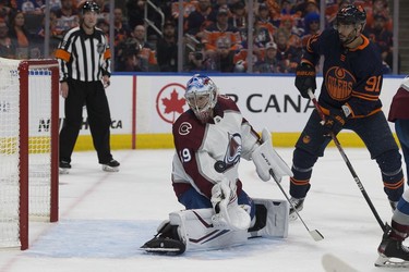 Edmonton Oilers' Evander Kane (91) and the Colorado Avalanche's goalie Pavel Francouz (39) look on as an Oiler shot goes off the post during the third period, during Game 3 of the Western Conference Final at Rogers Place, in Edmonton Saturday June 4, 2022.