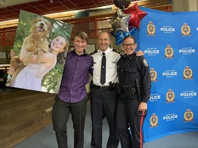 EPS Supt. Tom Pallas at his recent retirement party with a photograph of his daughter Maksi, 18, who is playing professional handball in Germany; son Zac, 20, and Pallas' wife Nikki, who works in the EPS recruit training unit.
