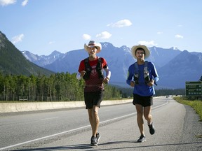Dave Proctor runs past the Banff exit along Highway 1 on July 16 on his journey running across Canada from St. John's, N.L. to Victoria, B.C. consistently running 106 kilometres each day.
