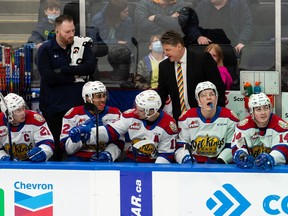 Edmonton Oil Kings' head coach Brad Lauer (right) talks to his team against the Red Deer Rebels during second period WHL action on Pride Day at Rogers Place in Edmonton, on Saturday, April 9, 2022.