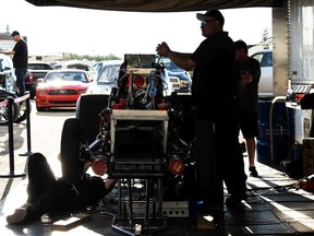 'Hot rubber, noisy engines': Rad Torque Raceway welcomes fans back 6 The Nitro Nostalgia Funny Car crew works on their car in the pit lane during the Rocky Mountain National at Rad Torque Raceway south of Edmonton on Friday July 8, 2022. Photo by Ian Kucerak