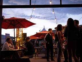 Edmonton Weather: Be Dazzled, Dazzled, as the Heat Rises 3 Edmontonians catch nightlife and comedy at the third annual Grindstone Comedy Festival in Edmonton on Friday, July 8, 2022. The festival runs through July 10. The City of Edmonton is looking to create a position to support the city's nighttime economy. bars, theaters, musical performances and more. Photo by Ian Kucerak
