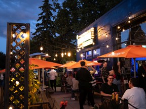 Edmontonians take in the nightlife and comedy performances during the third annual Grindstone Comedy Festival in Edmonton, on Friday, July 8, 2022. The festival runs through July 10. The City of Edmonton is looking to create a position to support the city's night economy of bars, theatres, musical performances and more. Photo by Ian Kucerak