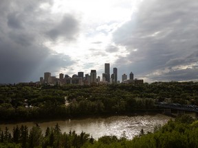 The sun breaks through clouds forming over downtown Edmonton in Edmonton, on Tuesday, July 19, 2022.