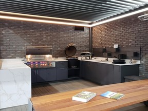 The full view of the kitchen with the ceiling slats opened and allowing light in, by Northern Shades.