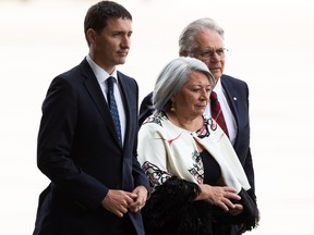 Prime Minister Justin Trudeau (left), Governor General of Canada Mary Simon (centre) and her partner Whit Fraser arrive before Pope Francis lands in Canada to starts his papal visit at Edmonton International Airport, on Sunday, July 24, 2022. A brief welcome ceremony greeted the head of the Catholic Church before he headed into Edmonton accompanied by his papal seguito (entourage).