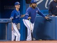 Toronto Blue Jays' Vladimir Guerrero Jr., right, pretends to coach with first base coach Mark Budzinski in the sixth inning of their American League MLB baseball game against the Tampa Bay Rays in Toronto Saturday September 28, 2019.