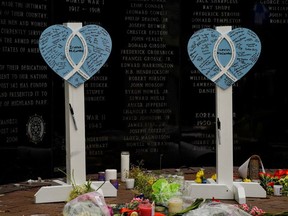 Memorials for victims Irena and Kevin McCarthy are seen at a memorial site after a mass shooting at a Fourth of July parade in the Chicago suburb of Highland Park, Illinois, U.S. July 6, 2022.