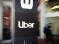 An Uber logo is seen outside the company's headquarters in San Francisco, California on May 8, 2019.
