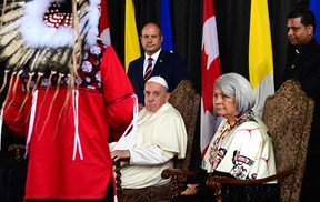 Pope Francis, next to Governor General of Canada Mary Simon (R), attends his welcoming ceremony at Edmonton International Airport in Alberta, western Canada, on July 24, 2022. - Pope Francis visits Canada for a chance to personally apologize to Indigenous survivors of abuse committed over a span of decades at residential schools run by the Catholic Church.