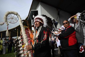 Chief Tony Alexis, of the Alexis Nakota Sioux Nations, prepares to participate in the traditional entrance of Indigenous leaders (Grand Entry of Chiefs) ahead of the arrival of Pope Francis, at Muskwa Park in Maskwacis, Alberta, Canada, on July 25, 2022. - Pope Francis will make a historic personal apology Monday to Indigenous survivors of child abuse committed over decades at Catholic-run institutions in Canada, at the start of a week-long visit he has described as a 