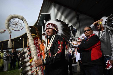 Chief Tony Alexis, of the Alexis Nakota Sioux Nations, prepares to participate in the traditional entrance of Indigenous leaders (Grand Entry of Chiefs) ahead of the arrival of Pope Francis, at Muskwa Park in Maskwacis, Alberta, Canada, on July 25, 2022. - Pope Francis will make a historic personal apology Monday to Indigenous survivors of child abuse committed over decades at Catholic-run institutions in Canada, at the start of a week-long visit he has described as a "penitential journey." \