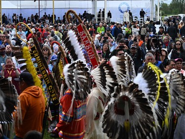 Members of the Indigenous community look on as Pope Francis arrives at Muskwa Park in Maskwacis, Alberta, Canada, on July 25, 2022. - Pope Francis will make a historic personal apology Monday to Indigenous survivors of child abuse committed over decades at Catholic-run institutions in Canada, at the start of a week-long visit he has described as a "penitential journey."
