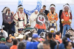 Pope Francis speaks (C) to members of the Indigenous community at Muskwa Park in Maskwacis, Alberta, Canada, on July 25, 2022. - Pope Francis will make a historic personal apology Monday to Indigenous survivors of child abuse committed over decades at Catholic-run institutions in Canada, at the start of a week-long visit he has described as a 