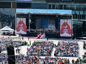 Pope Francis participates in an open-air mass at Commonwealth Stadium in Edmonton, Canada, on July 26, 2022. - The Pope will be celebrating the feast of St. Anne, grandmother of Jesus, a day of particular reverence for Indigenous Catholics.