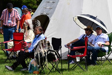 Members of the Indigenous community await the arrival of Pope Francis at Lac Ste. Anne, northwest of Edmonton, Alberta, Canada, on July 26, 2022.