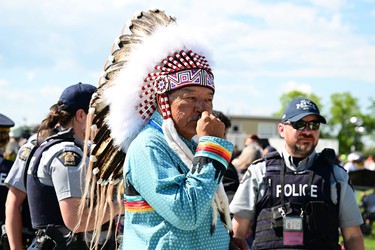 An Indigenous community member awaits the arrival of Pope Francis at Lac Ste. Anne, northwest of Edmonton, Alberta, Canada, on July 26, 2022.