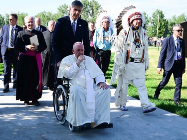 Chief Tony Alexis, of the Alexis Nakota Sioux Nation, walks alongside Pope Francis during the Lac Ste. Anne Pilgrimage and Liturgy of the Word at Lac Ste. Anne, northwest of Edmonton, Alberta, Canada, July 26, 2022.