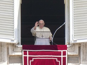 Pope Francis recites the Angelus noon prayer from the window of his studio overlooking St. Peter's Square at the Vatican on July 3, 2022.