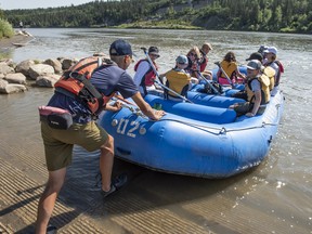 Guide River Hoffos prepares the passengers on his raft for the launch. The first of three rafts hits the waters of the North Saskatchewan River on July 28, 2022. RiverWatch Institute of Alberta has guided EcoFloat tours of the city waterway. Shaughn Butts - Postmedia