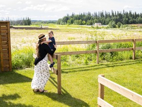 Alaryn Callihoo and her three-year-old son, Alek,  enjoy the space in the new community of Riverside, in St. Albert.