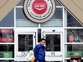 A shopper leaves the Co-op grocery store at Mill Woods Town Centre on May 8, 2014. The location was formerly a Safeway grocery store.