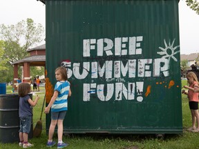 Kids paint the Green Shack during the launch of the City's 2016 summer season of free neighbourhood drop-in programs at Central McDougall Park in Edmonton July 5, 2016. The City of Edmonton has been offering summer drop-in programs, including Green Shack, Flying Eagle, Pop Up Play and YEGYouth, for more than 50 summers in a row.