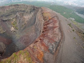 An aerial view taken from an helicopter window shows the crater of the mount Vesuvius volcano, is seen near the Italian city of Naples on March 31, 2009.