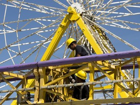 Crews works to set up rides ahead of the start of K-Days in Edmonton, Thursday, July 21, 2022. K-Days runs from July 22 to 31.