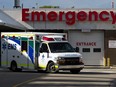 An ambulance leaves the emergency department at the Misericordia Hospital in Edmonton on July 6, 2020.