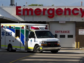 An ambulance leaves the emergency department at the Misericordia Hospital, in Edmonton Monday July 6, 2020.