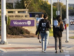 Students walk at the Western University campus in London, Ont. on Wednesday, September 15, 2021. A new Statistics Canada study finds college graduates, women, and graduates of some programs were more likely to access the Canada Emergency Response Benefit (CERB) program in 2020 than others. The study compared the proportion of 2010 to 2018 post-secondary graduates who received CERB based educational and socio-demographic characteristics to the proportion of all workers who received the benefit.