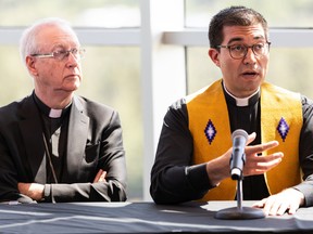 Edmonton Archbishop Richard Smith, left, and Rev. Cristino Bouvette, the visit's national liturgical co-ordinator, are seen during a papal visit news conference with organizers at the Edmonton Convention Centre  on Saturday, July 23, 2022.