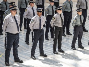 Eighteen peace officers celebrated their graduation at city hall in Edmonton on Tuesday, July 12, 2022.